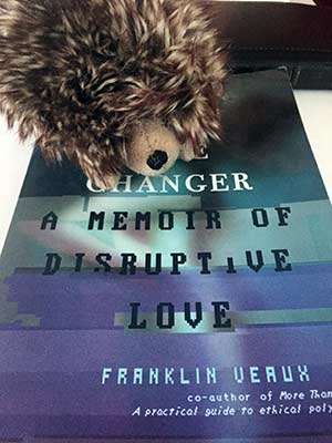 That is Lilith the Hedgehog sitting on the book. She accompanied us throughout Europe too.